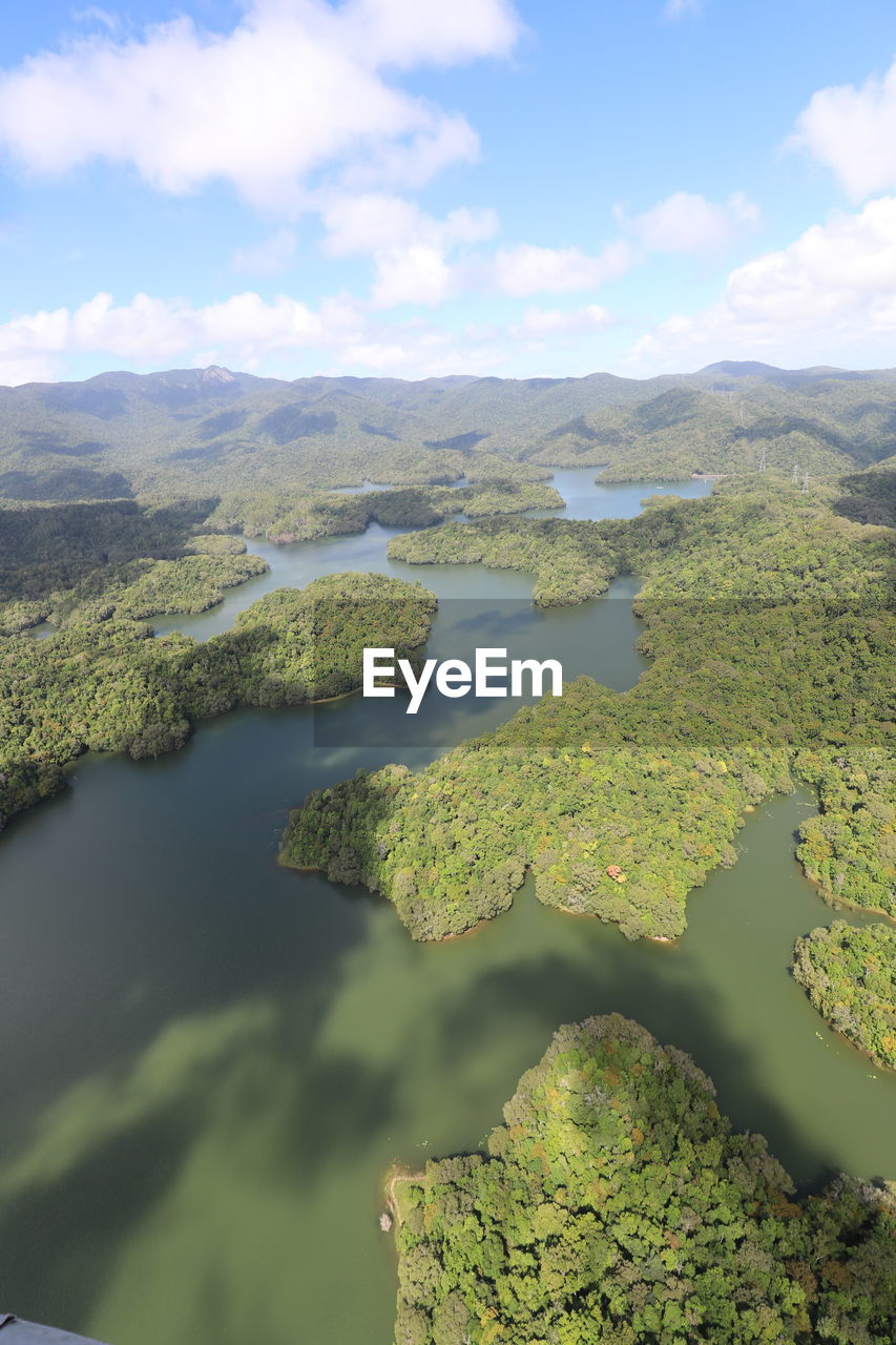 AERIAL VIEW OF LAKE AND LANDSCAPE AGAINST SKY