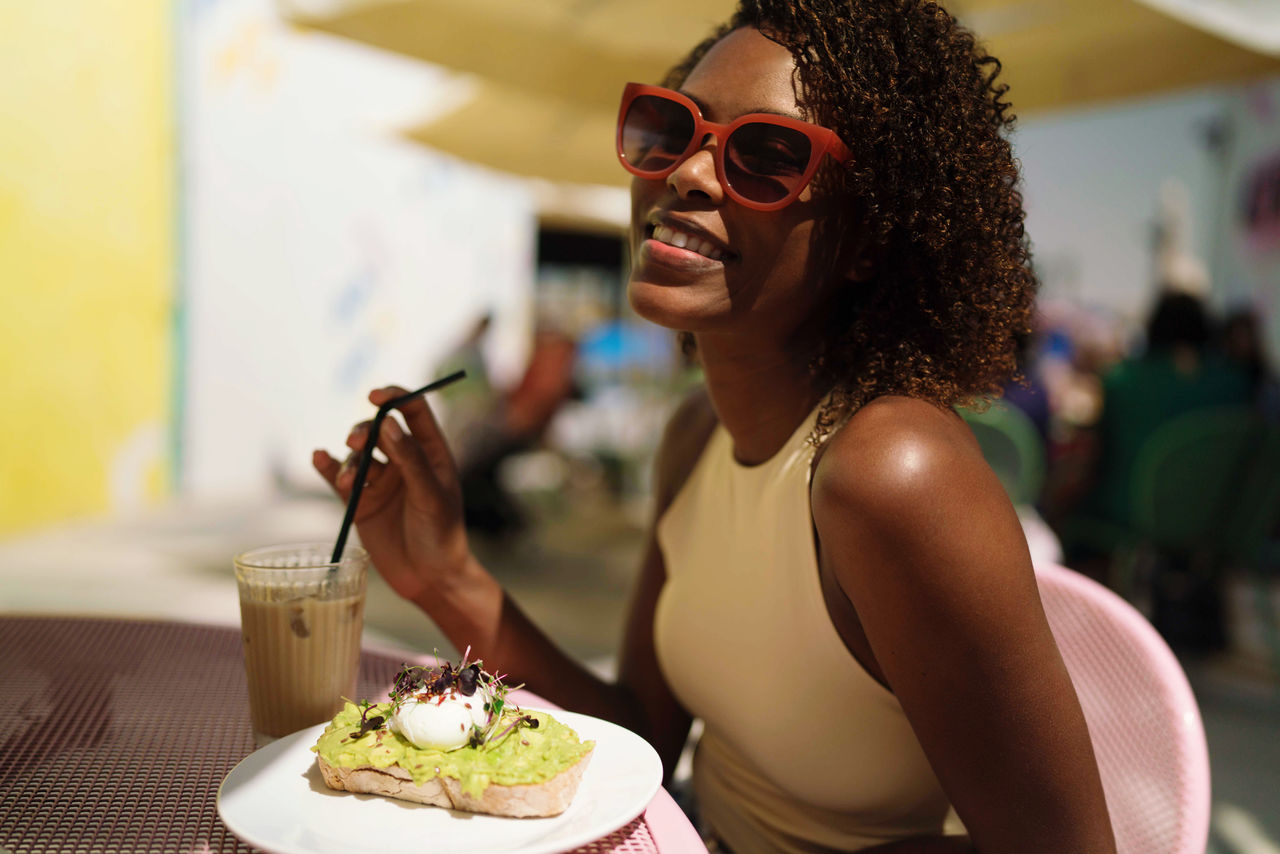 Woman sitting in the outdoor cafe