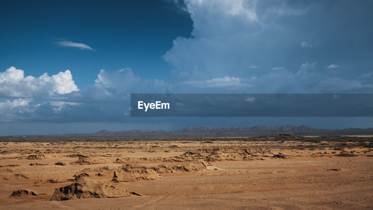 Scenic view of desert against sky