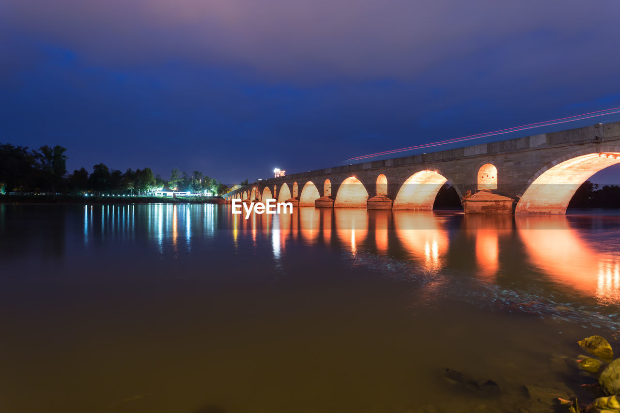 ARCH BRIDGE OVER RIVER AGAINST SKY