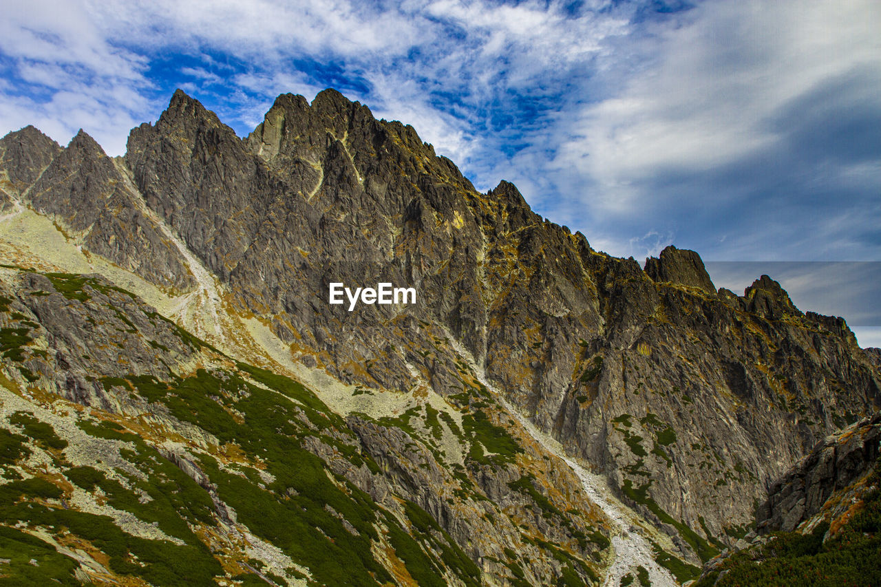 Low angle view of rock formations against sky