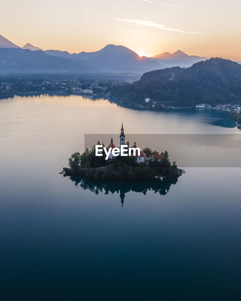 Aerial view of cerkev marijinega, a catholic church on a small island in the middle of bled lake 