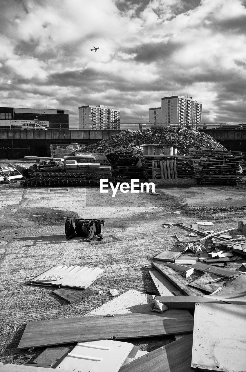 CONSTRUCTION SITE AGAINST BUILDINGS IN CITY