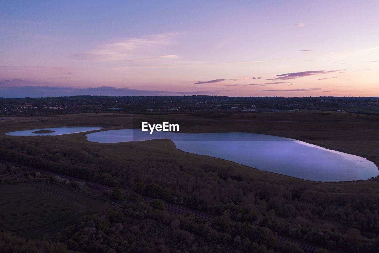 SCENIC VIEW OF LANDSCAPE AGAINST SKY AT SUNSET