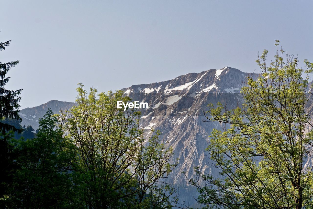 SCENIC VIEW OF MOUNTAINS AND CLEAR SKY