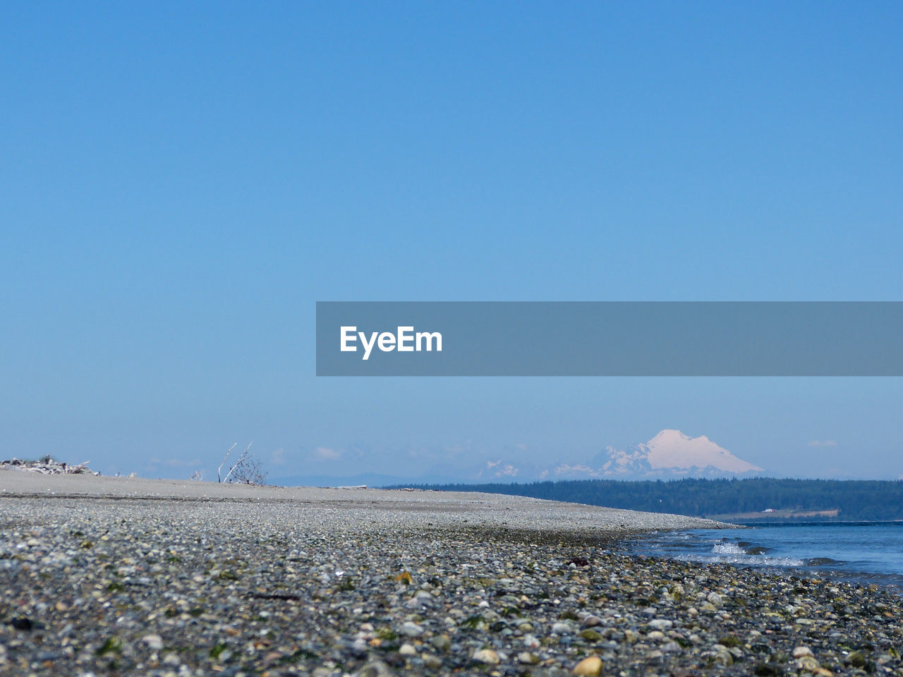 Scenic view of calm sea against clear sky