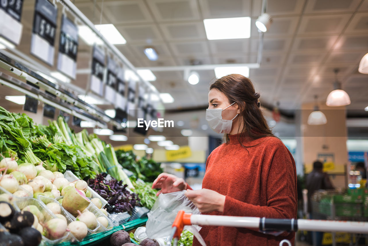 Full length of woman standing at market