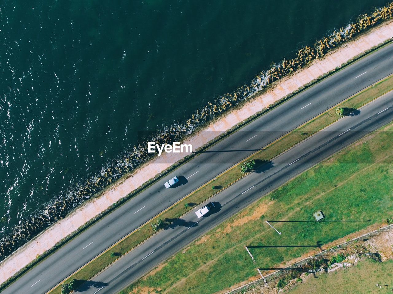 Aerial view of road by sea