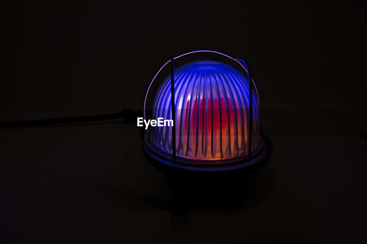 CLOSE-UP OF ILLUMINATED LIGHT BULB
