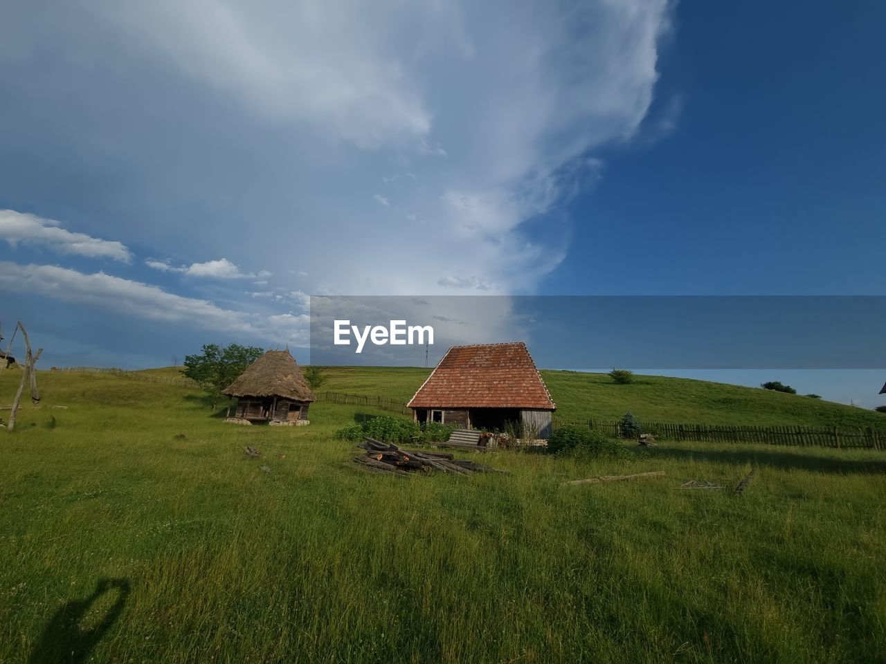 House on field against sky