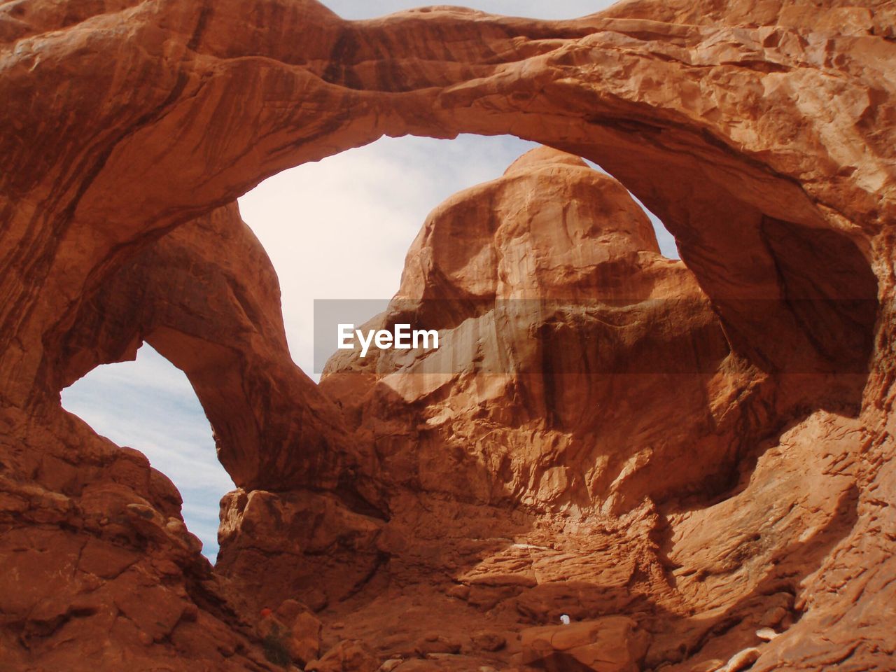 Low angle view of rock formations against sky