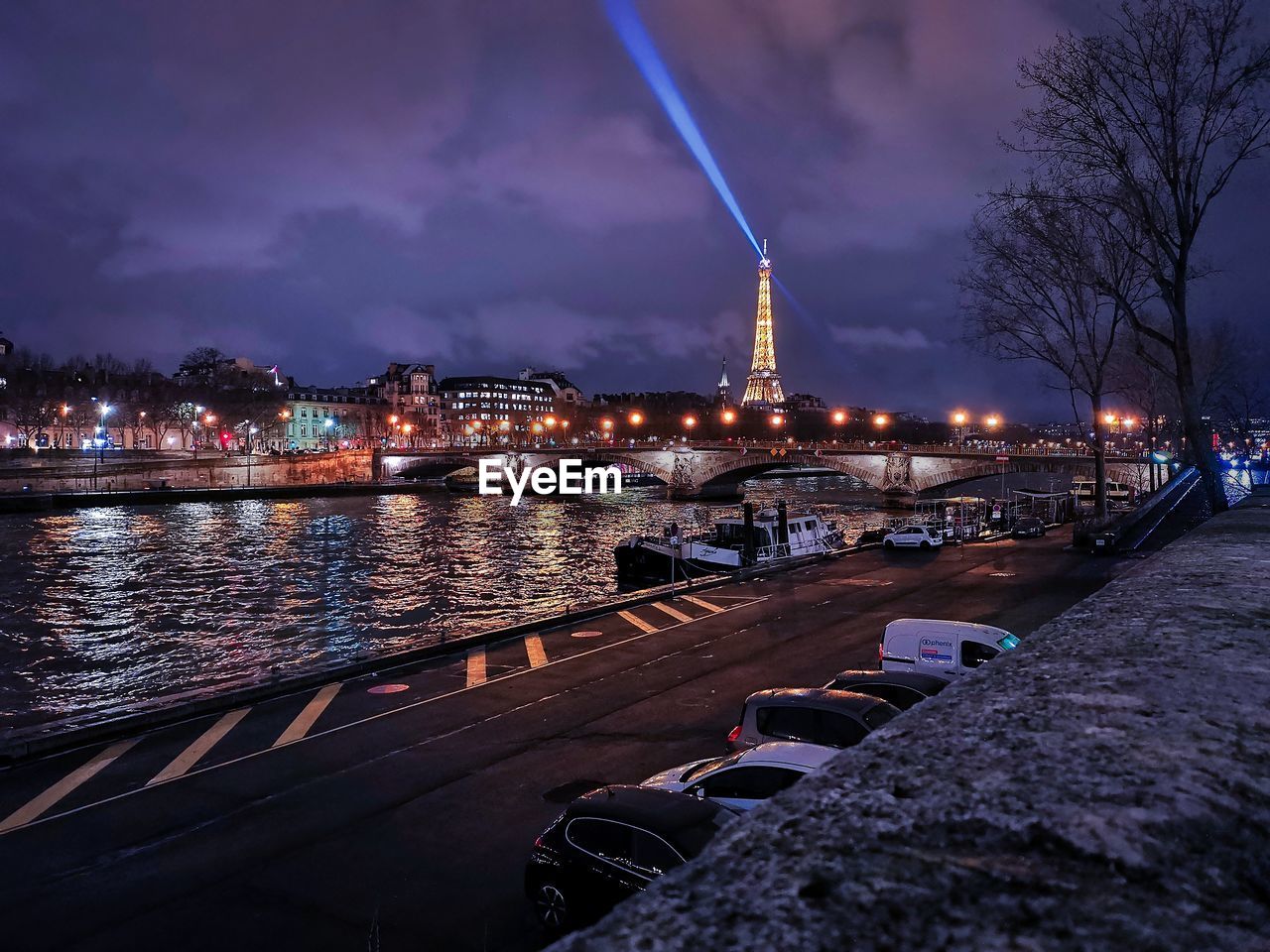 ILLUMINATED CITY AGAINST SKY AT NIGHT