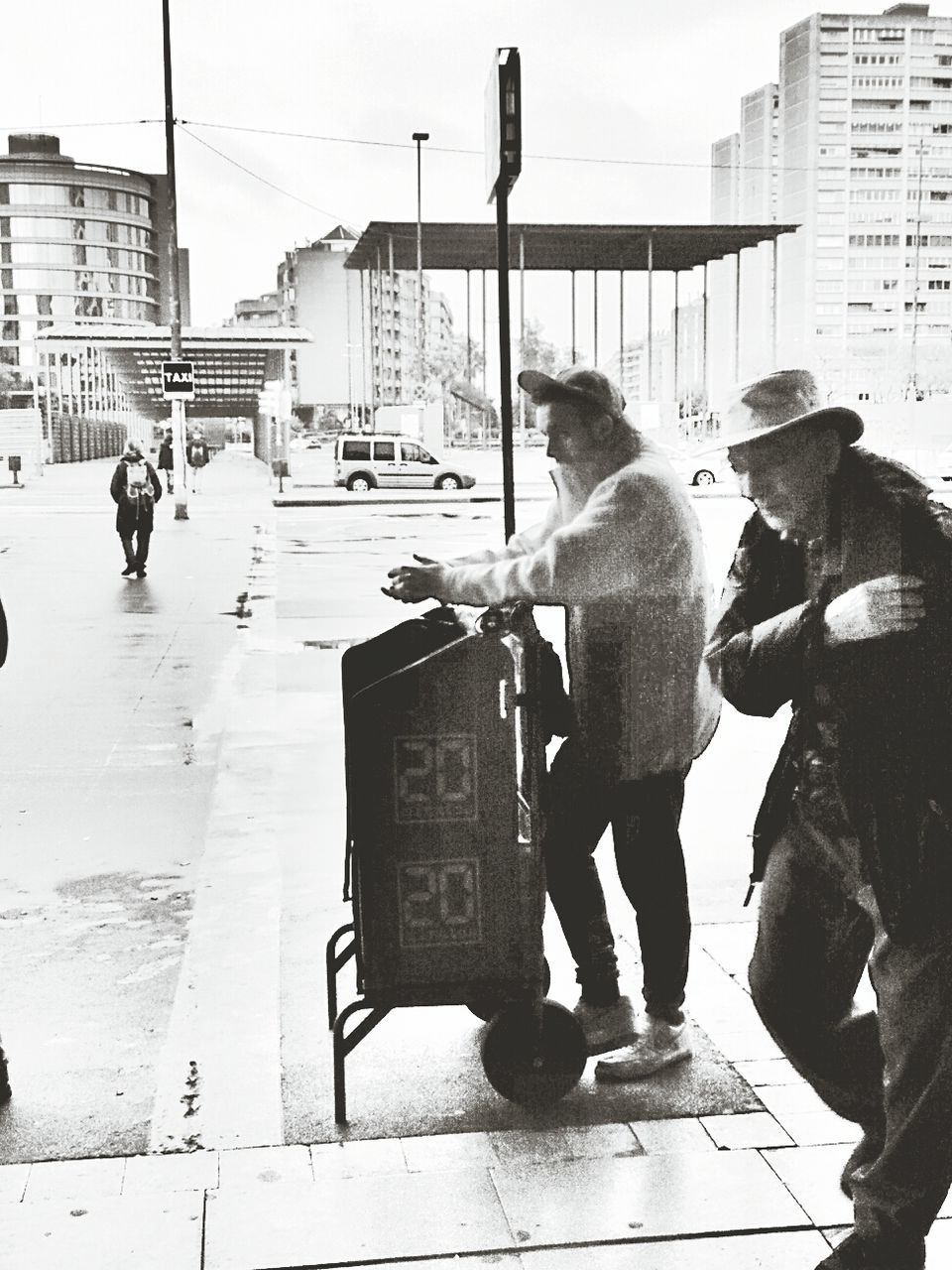 PEOPLE WALKING ON CITY STREET