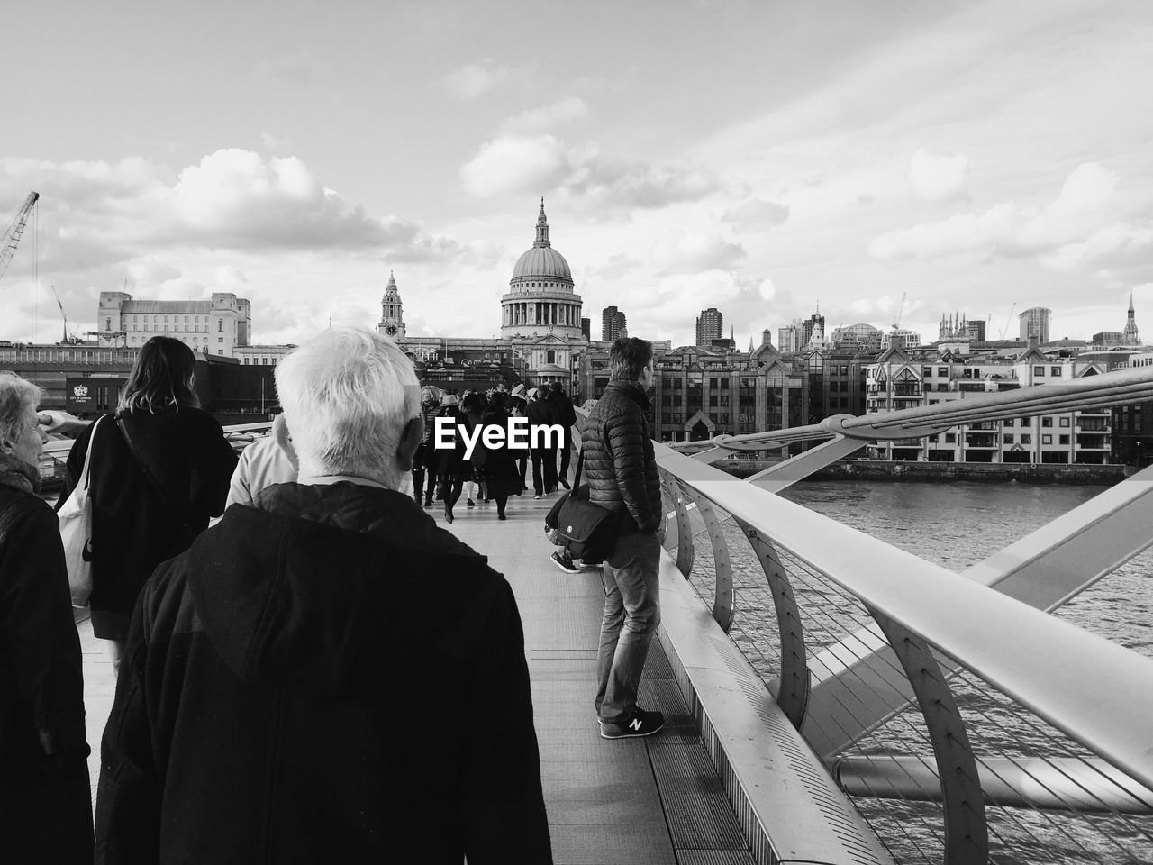 People walking on london millennium footbridge 