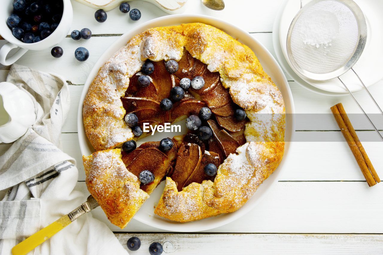 Fruit galette. homemade rustic pear tart with blueberry. healthy food.