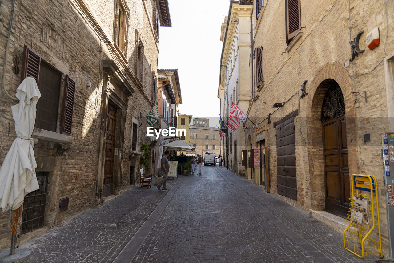 NARROW STREET AMIDST BUILDINGS