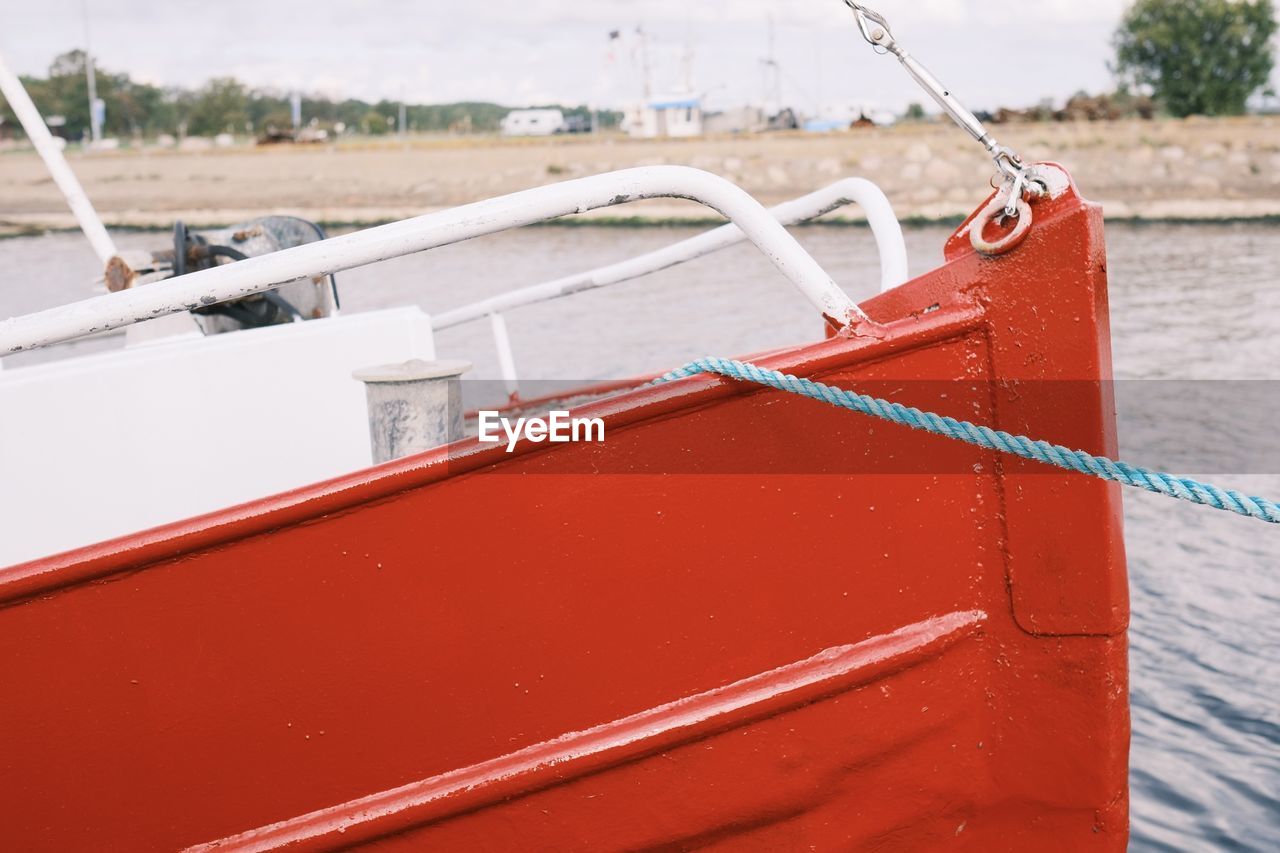 water, boat, nautical vessel, transportation, vehicle, red, mode of transportation, watercraft, sailboat, nature, ship, skiff, no people, day, outdoors, harbor, sea, dinghy, mast, travel, moored, rope, buoy