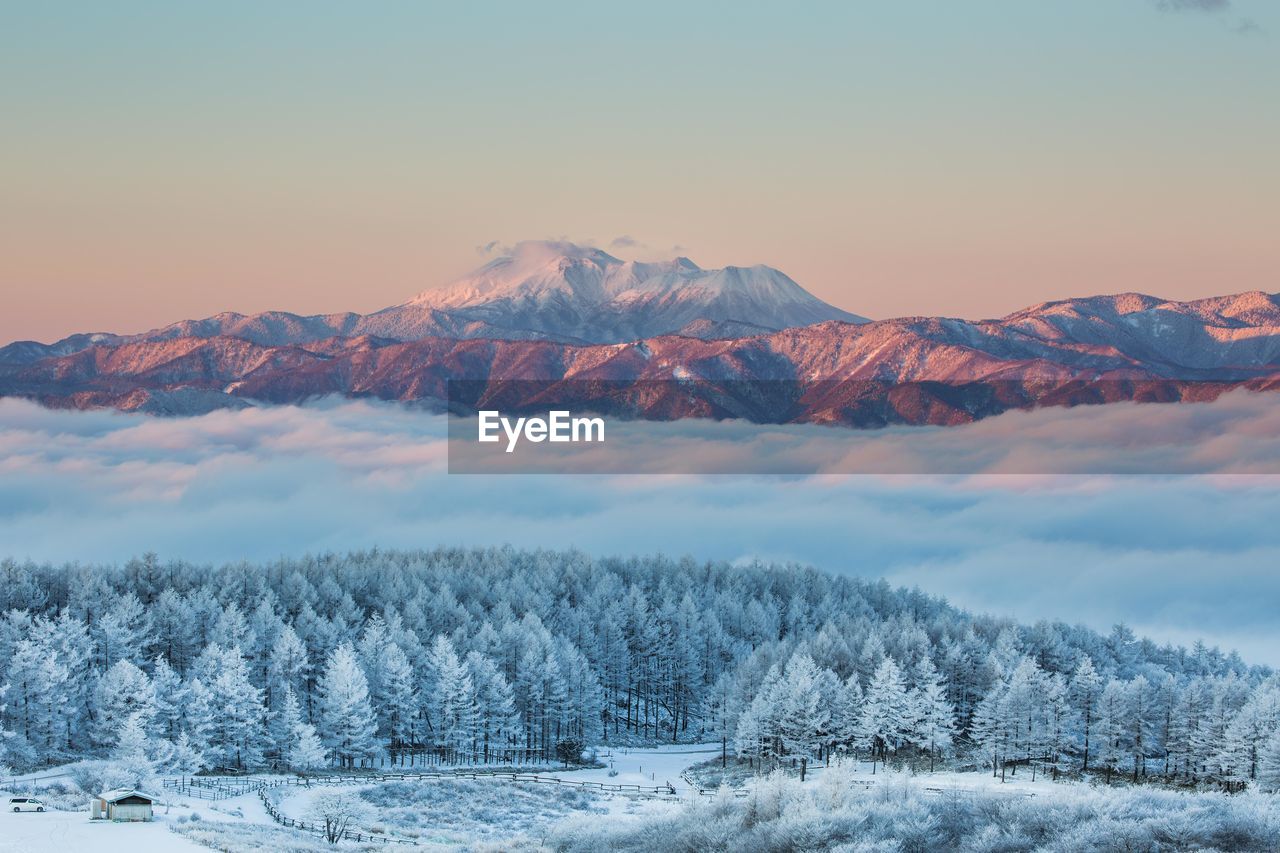 Scenic view of snowcapped mountain against sky during winter