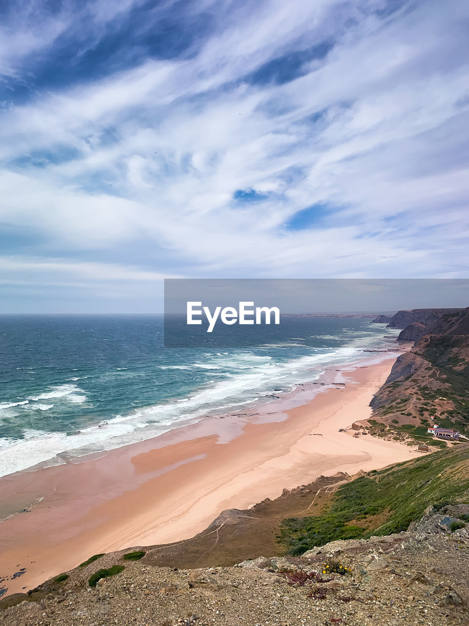 Scenic view of beach against sky