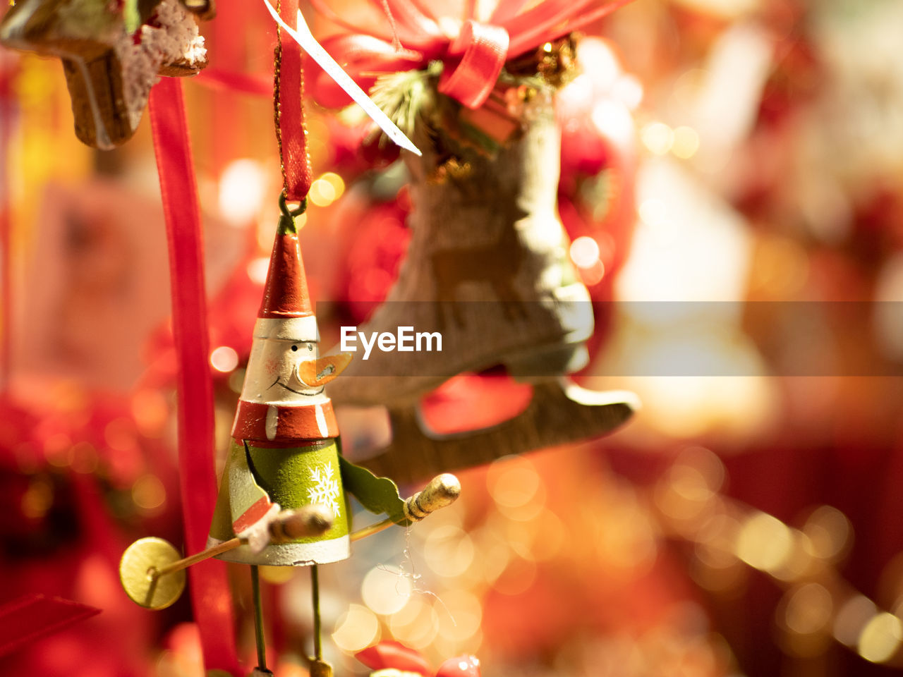 CLOSE-UP OF CHRISTMAS DECORATION HANGING ON STREET