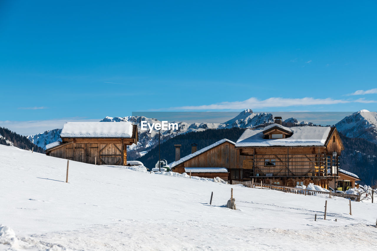 Winter magic. the ancient wooden houses of sauris di sopra. italy