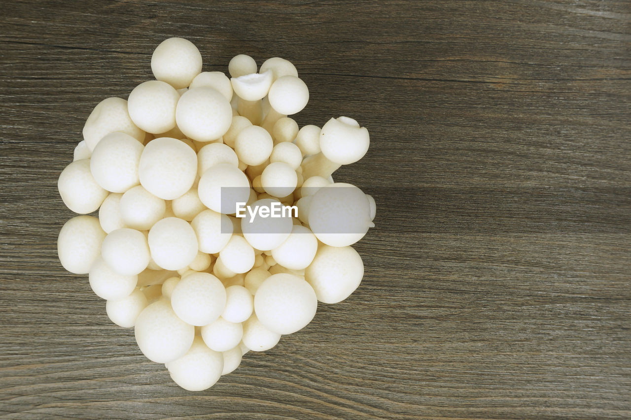 HIGH ANGLE VIEW OF EGGS IN CONTAINER ON TABLE