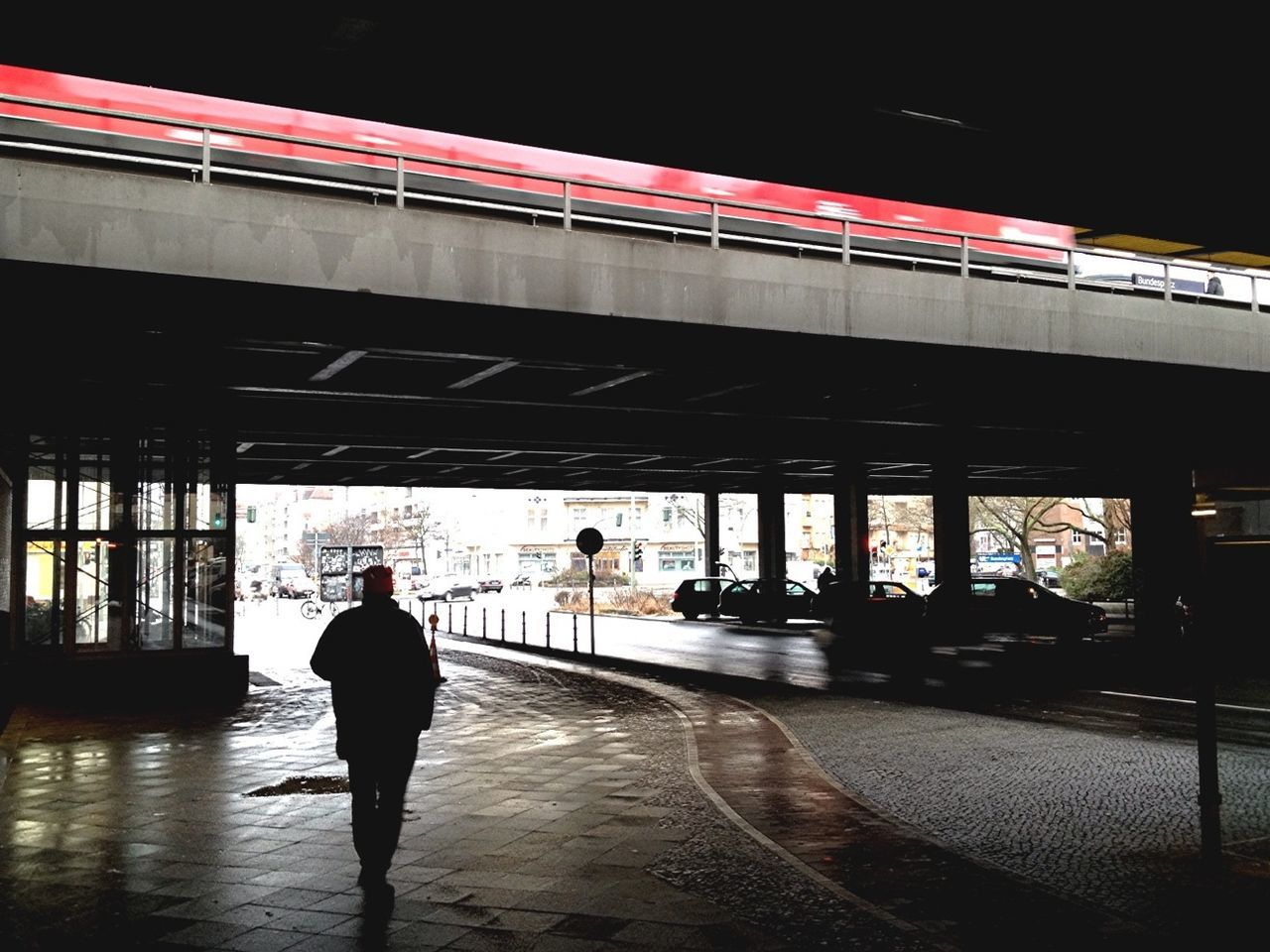 View of man under elevated road