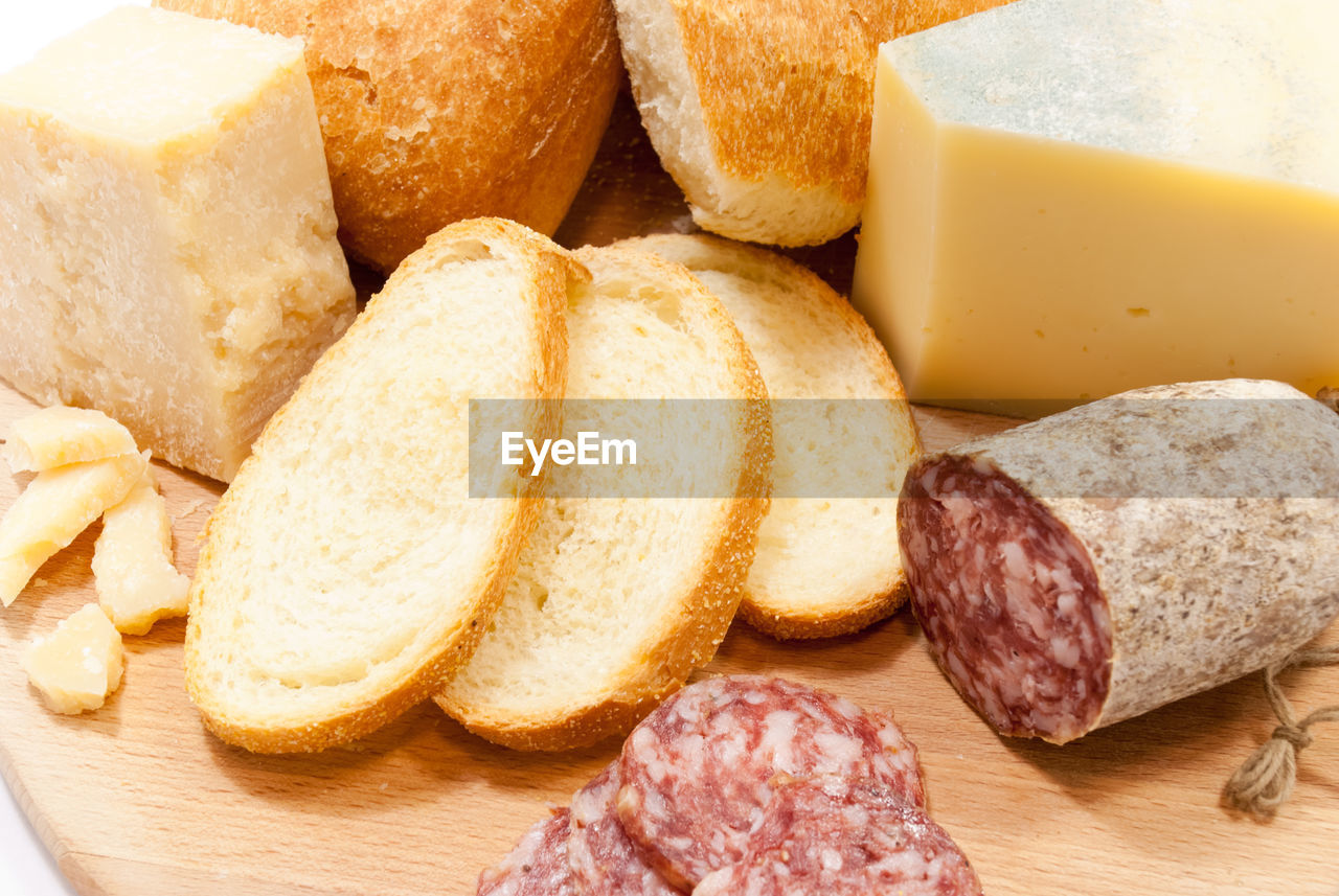 High angle view of bread with meat and cheese on table