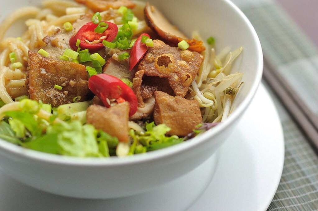 Close-up of serving noodles in bowl