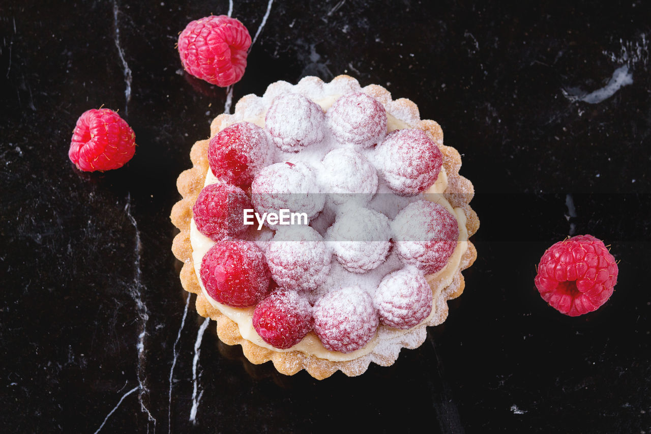 Close-up of dessert with raspberries on table