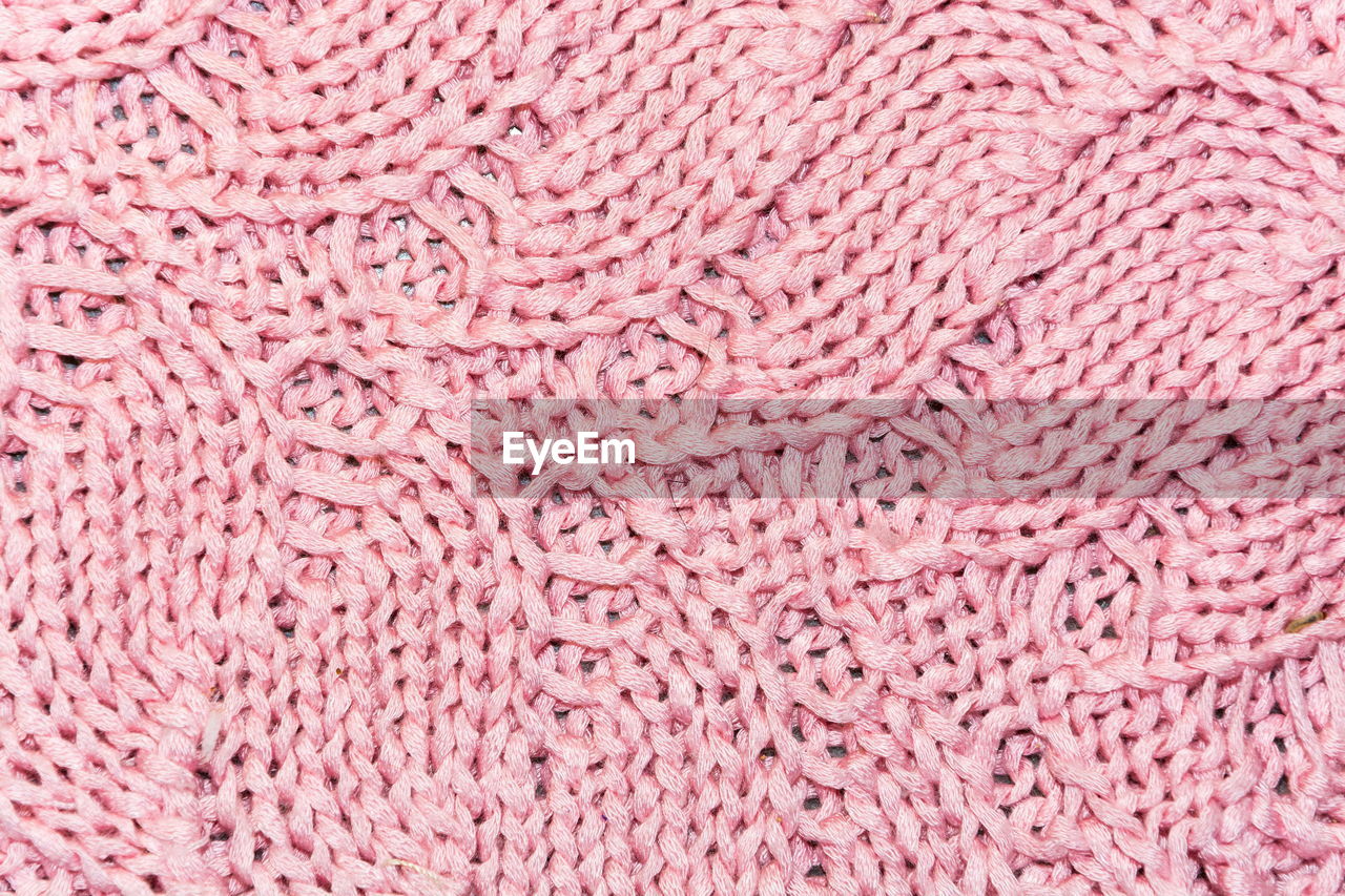 Full frame shot of pink knitted fabric