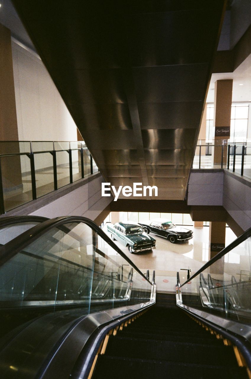 architecture, indoors, built structure, staircase, interior design, public transport, steps and staircases, railing, stairs, transportation, transport, building