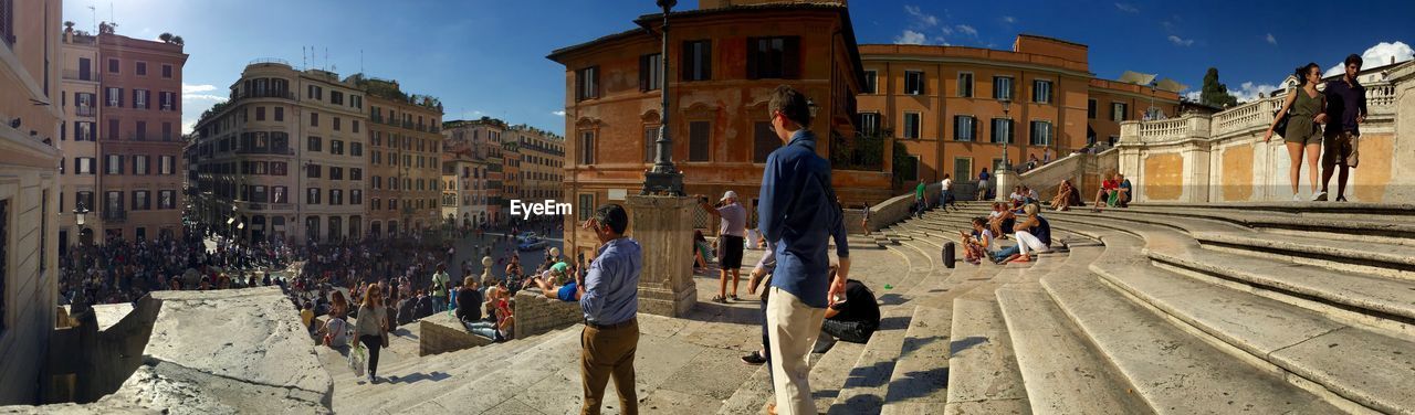 Panoramic view of people at spanish steps in city