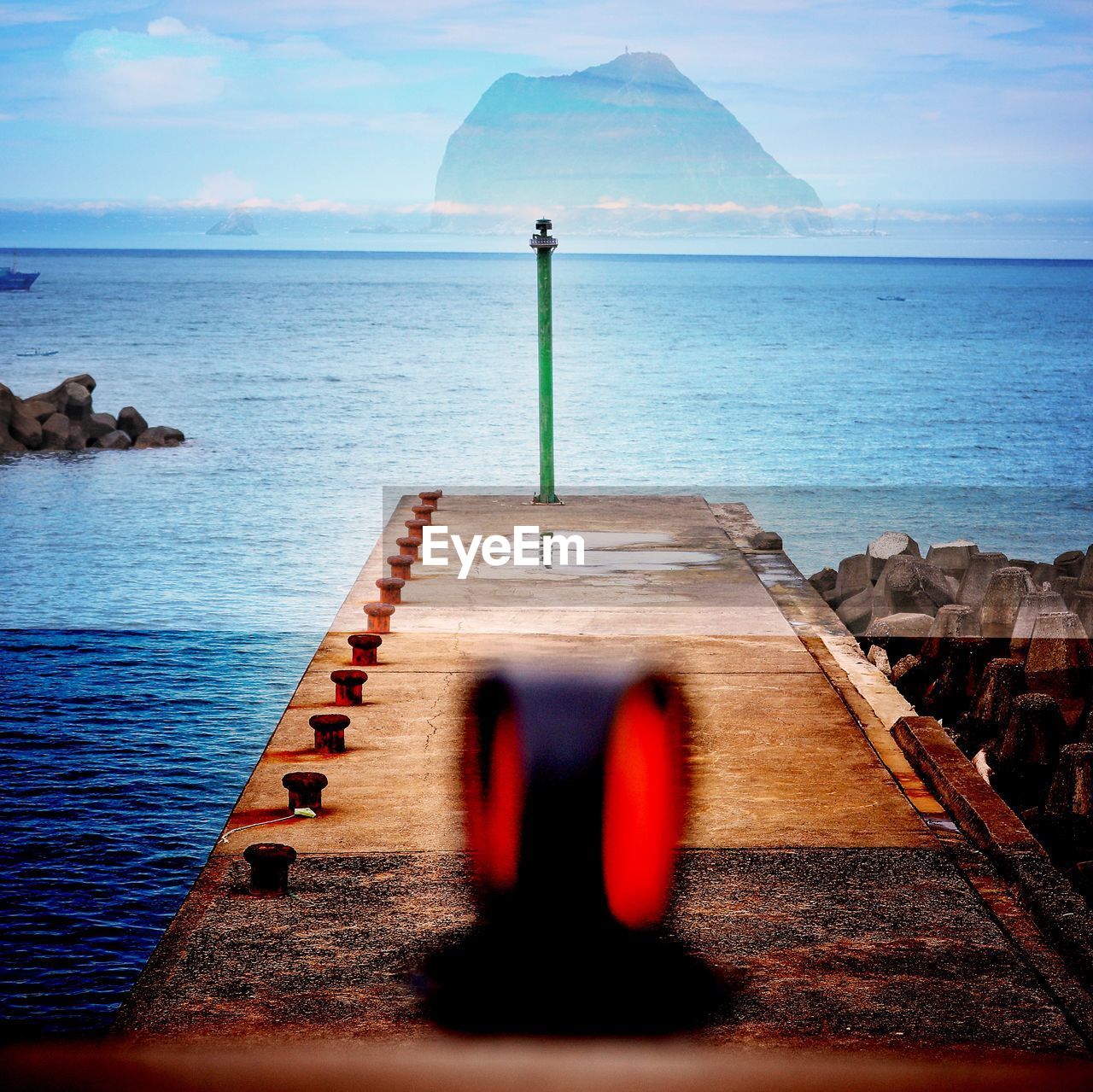 Blurred motion of equipment on pier at beach