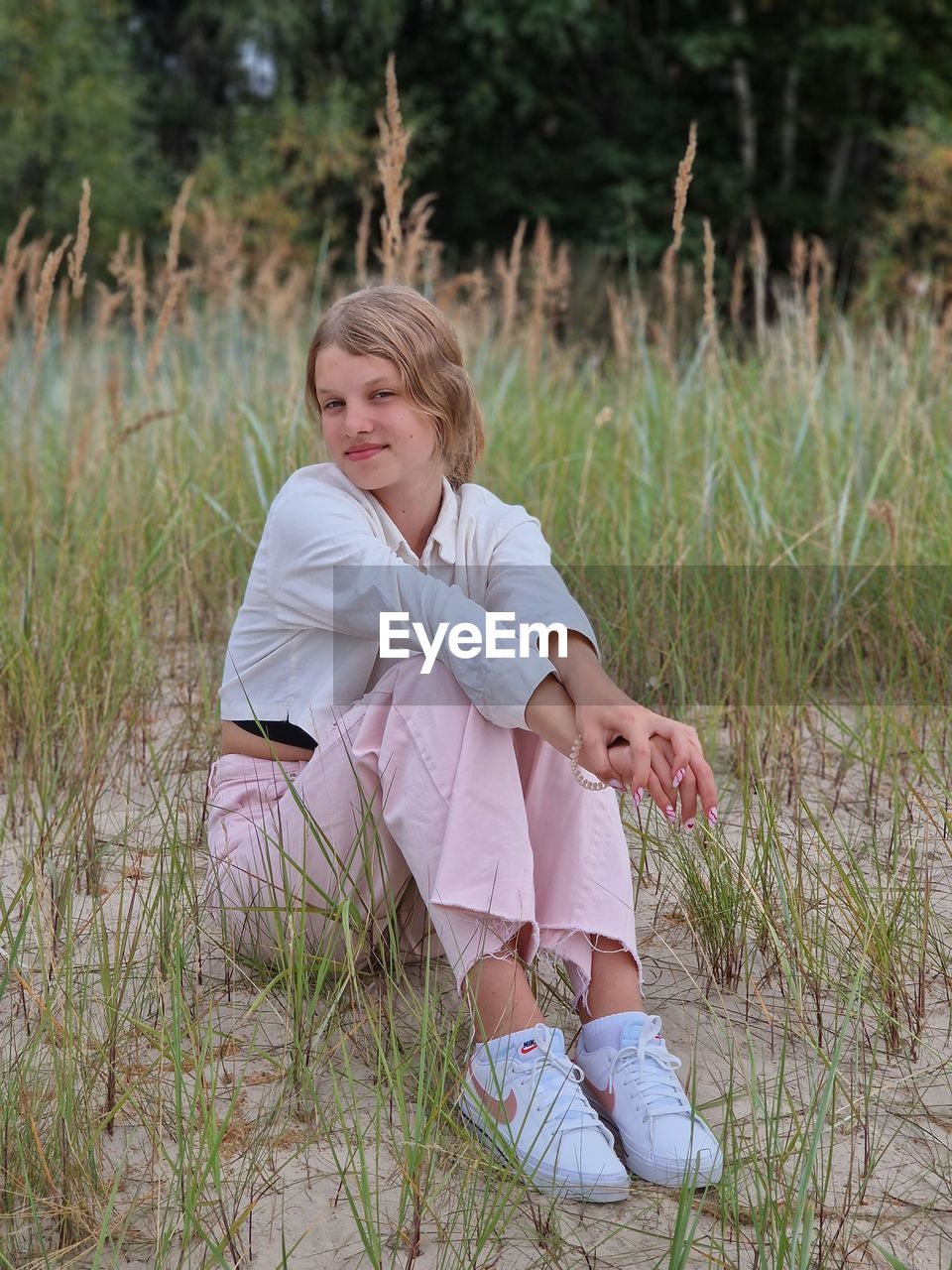 Beautiful girl in sitting near the jurmala beach