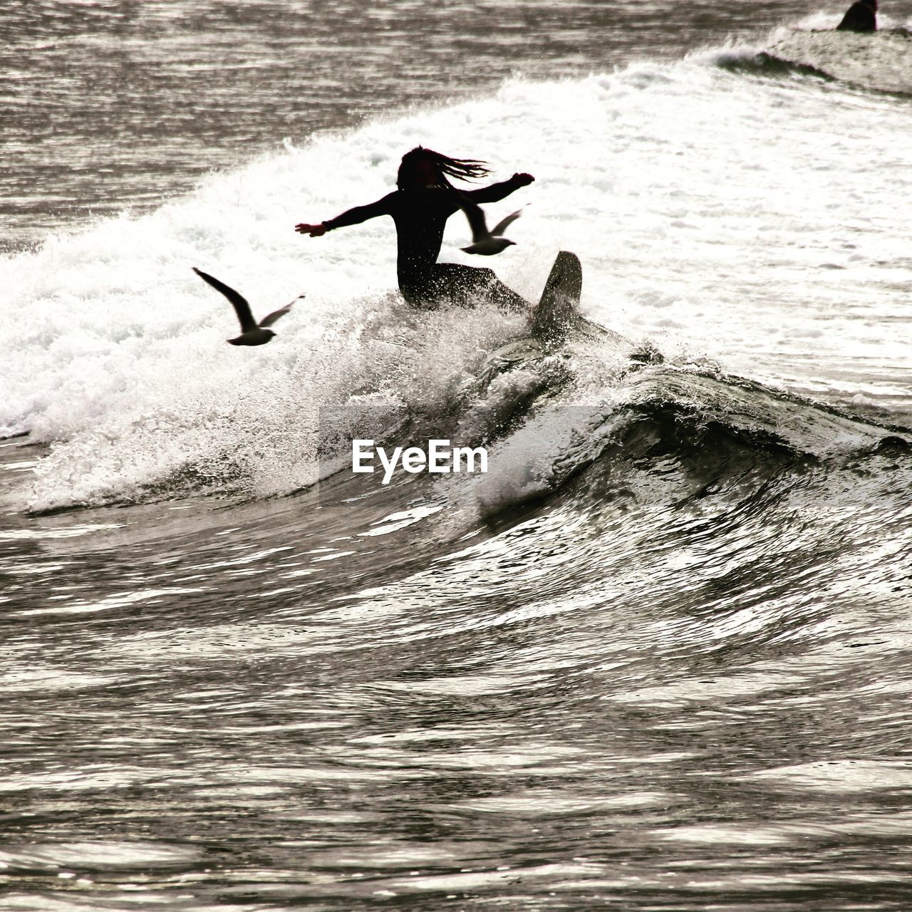 Full length of man flying over sea