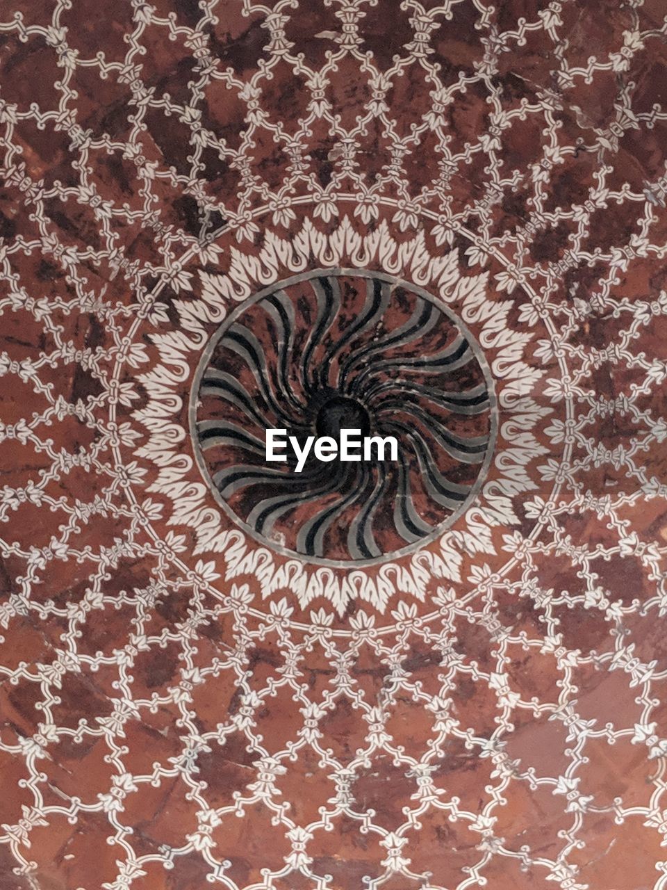 DIRECTLY BELOW SHOT OF ORNATE DECORATION