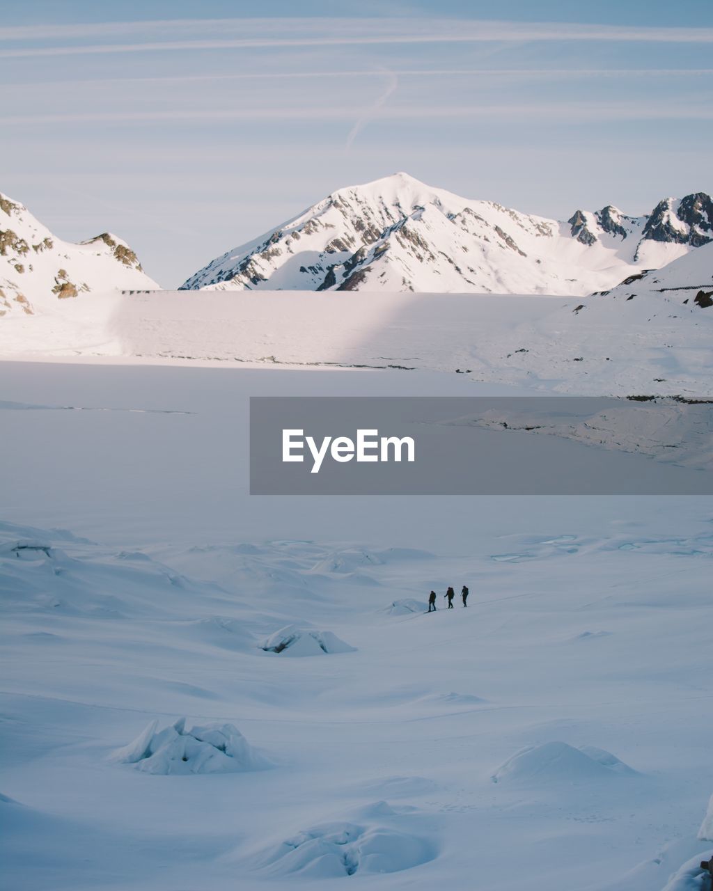 Scenic view of snow covered mountains against sky