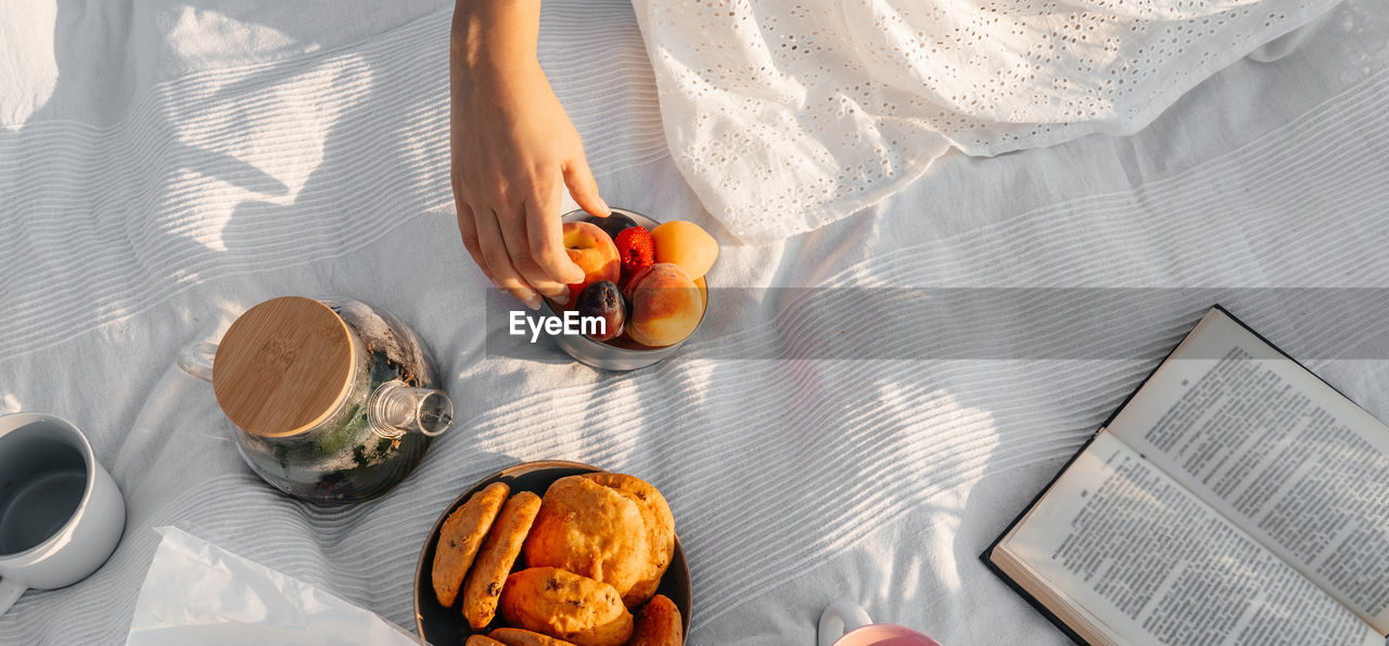 midsection of man holding food on table