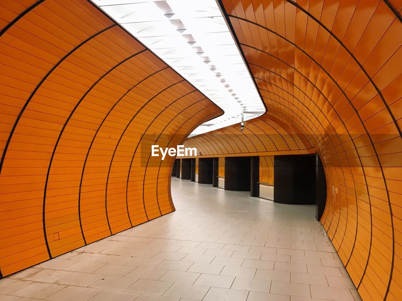 Interior of illuminated orange tunnel
