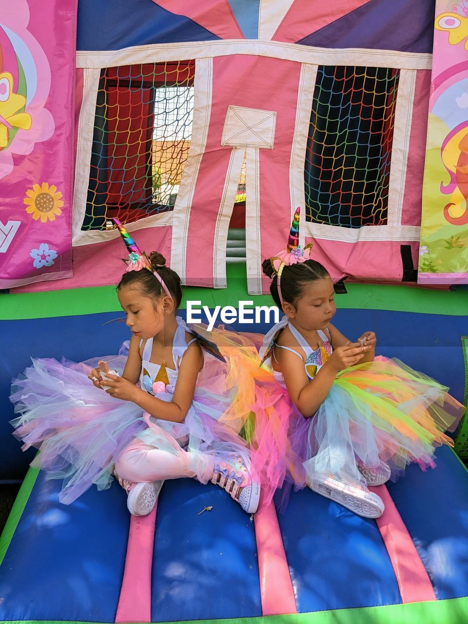 High angle view of girls siting at playground