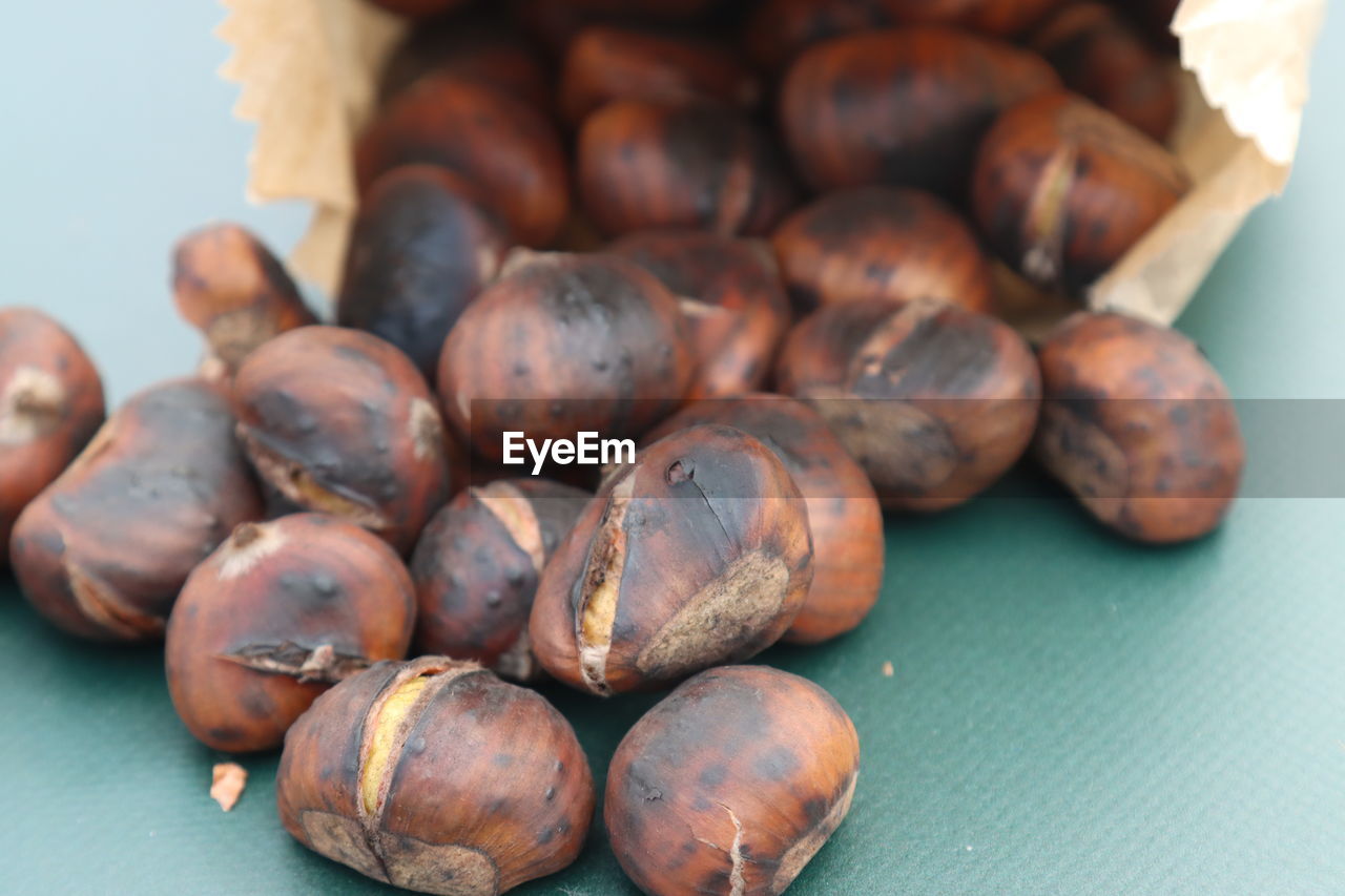 Close-up of roasted coffee beans on table