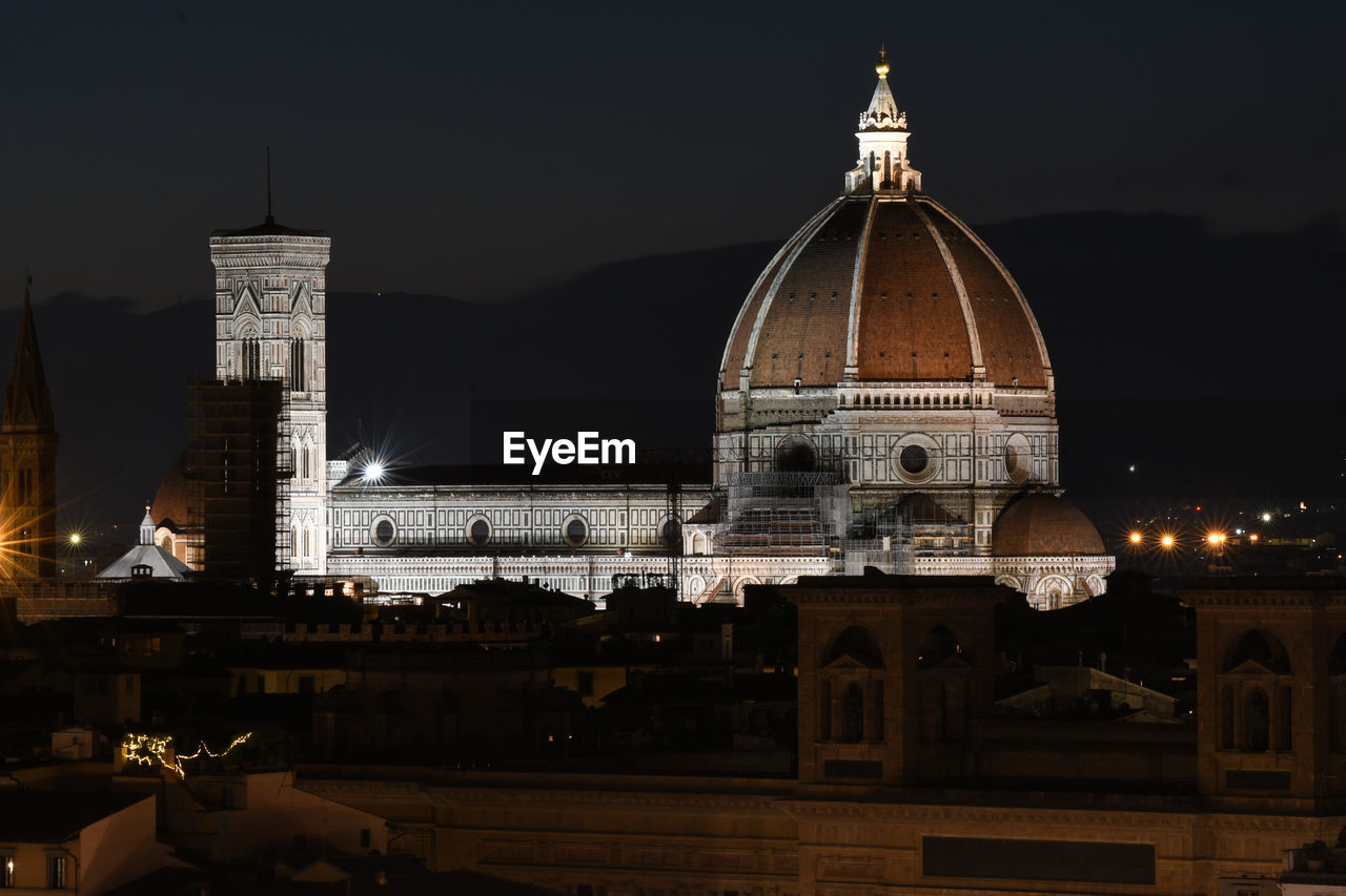 View of illuminated building against sky at night