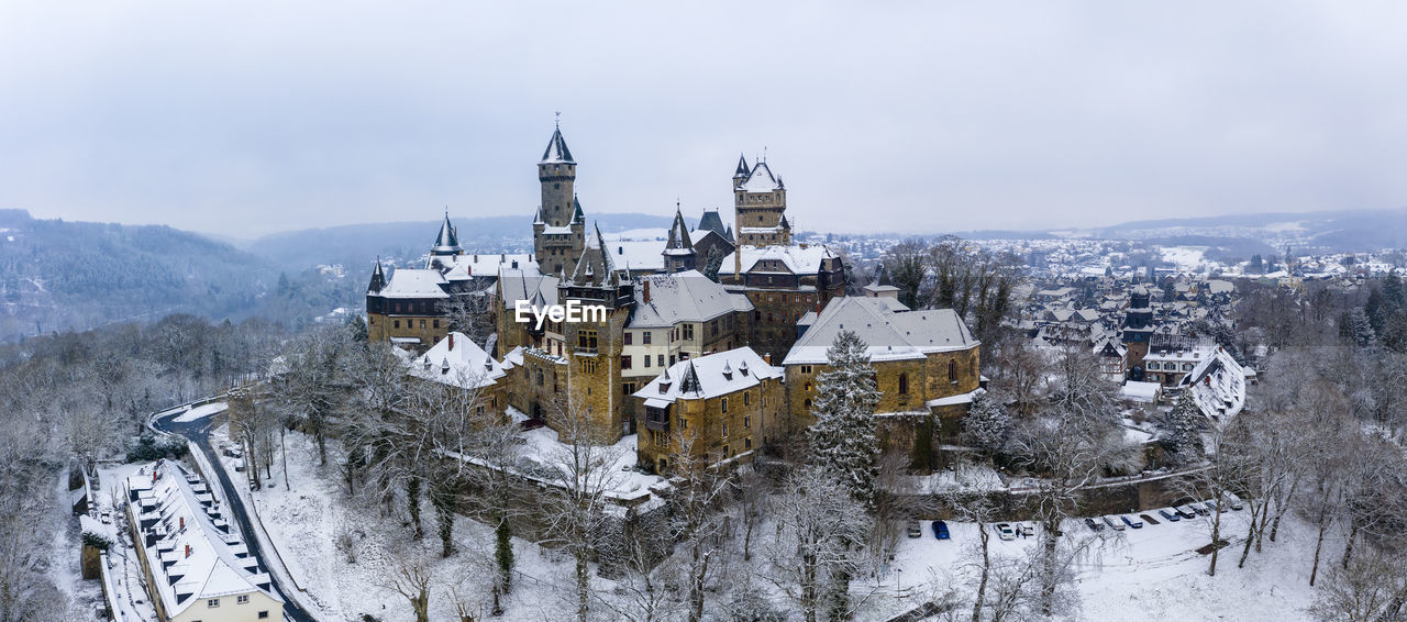 Germany, hesse, braunfels, helicopter panorama of braunfels castle and surrounding town in winter
