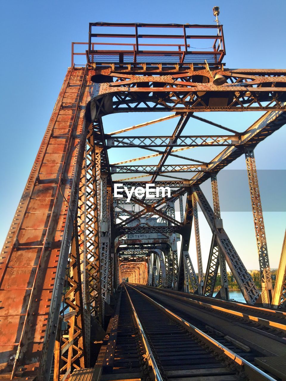 Low angle view of railroad tracks against clear sky