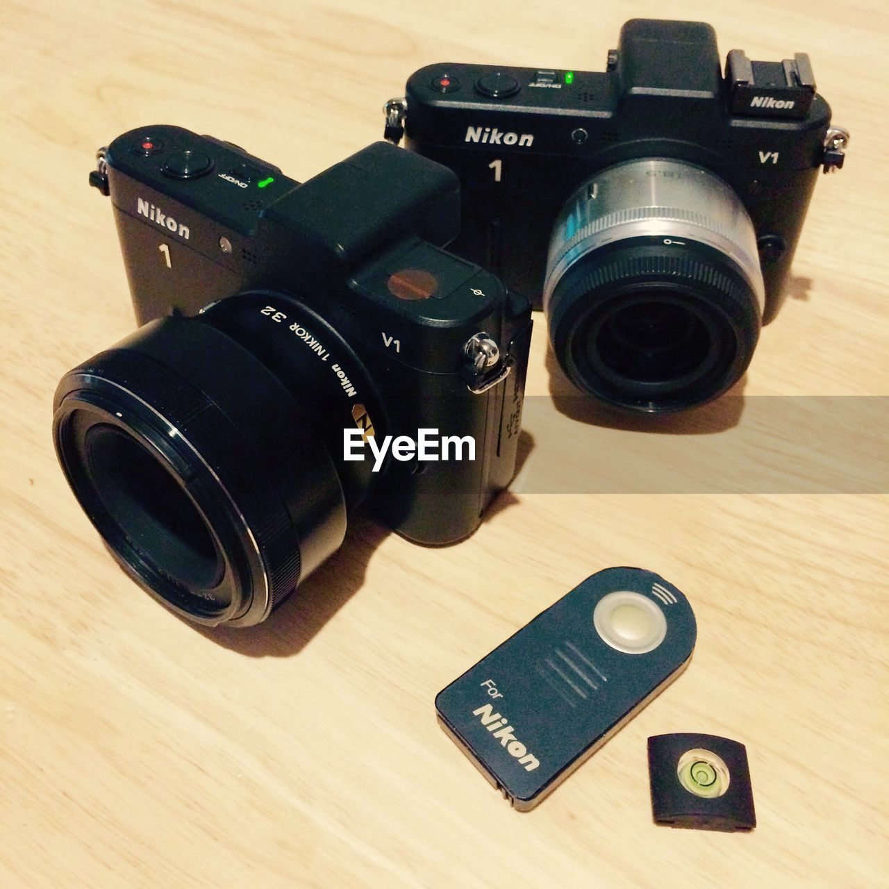 CLOSE-UP OF CAMERA ON TABLE WITH EYEGLASSES