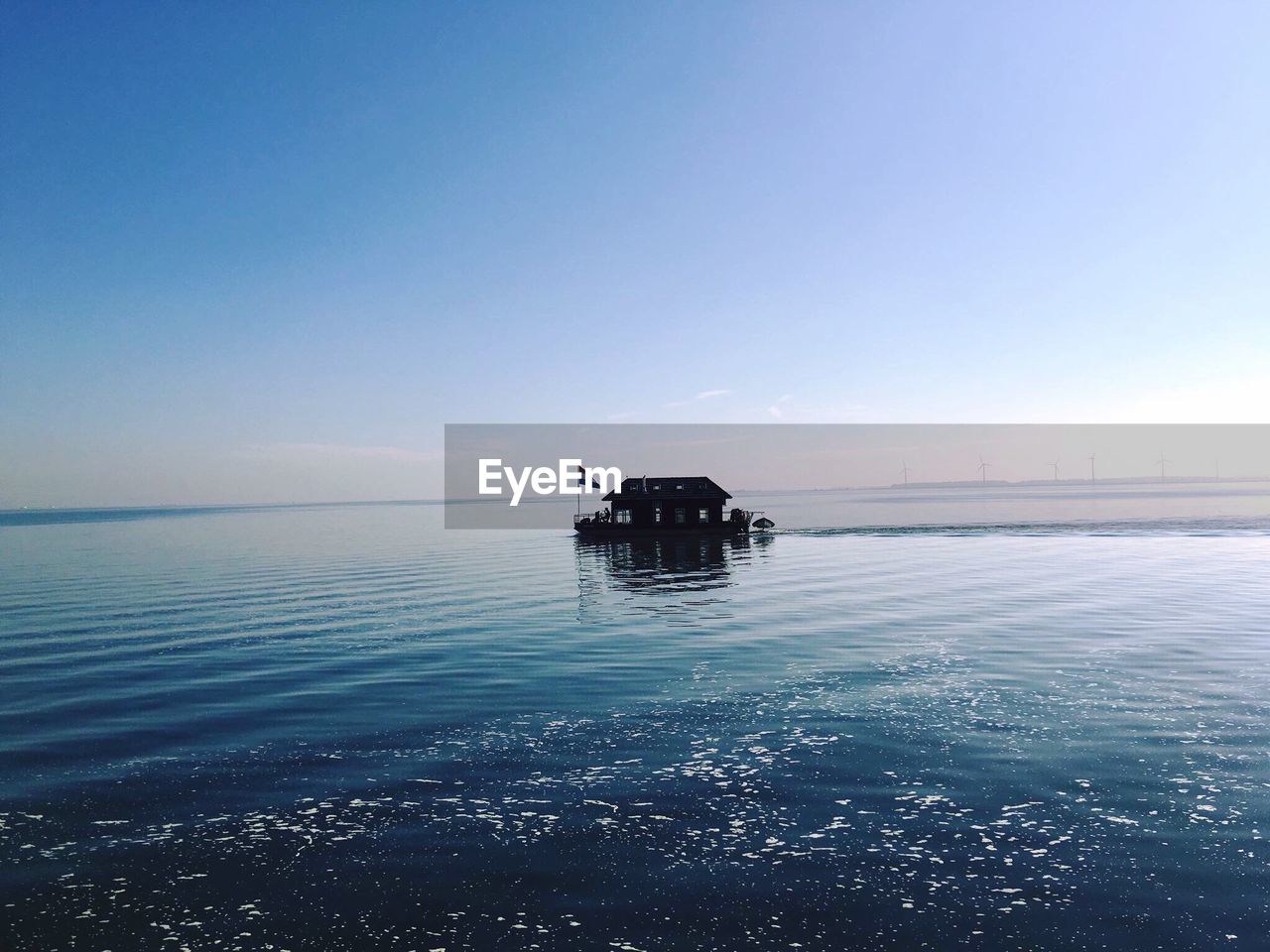 Boat on sea against clear sky