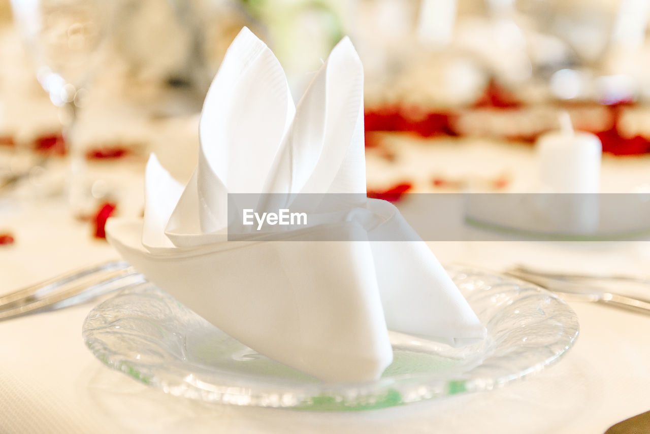 Close-up of napkin in plate on table