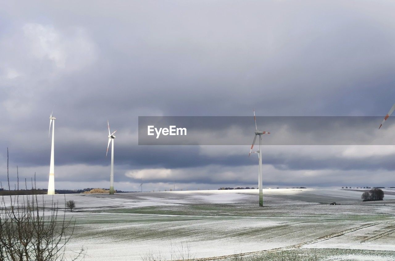 wind, sky, environment, cloud, nature, sea, wind power, water, wind turbine, land, beauty in nature, environmental conservation, turbine, snow, renewable energy, no people, day, beach, landscape, transportation, scenics - nature, alternative energy, overcast, outdoors, tranquility, storm, power generation, social issues, wind farm, coast, travel, tranquil scene, architecture, power in nature, non-urban scene, horizon, grass, windmill, built structure, winter, wave, dramatic sky, cold temperature, shore