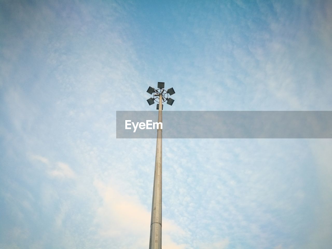 Low angle view of floodlight against sky